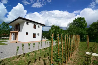 a small house with a fence in front of it at Villa Sabina in Lohovo