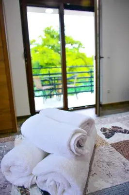 a pile of towels sitting on the floor in a room at Villa Sabina in Lohovo