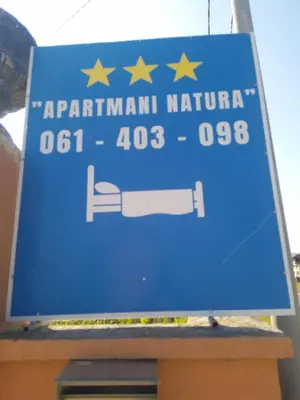 a blue sign for a patrilinian national highway at Apartmani Natura in Sanski most