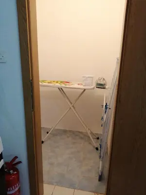 a small table in a room with a table at Amina River Apartment in Bihać