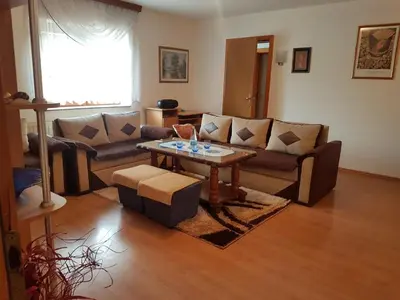 a living room with a couch and a table at Kuca za odmor Sarcevic in Prozor