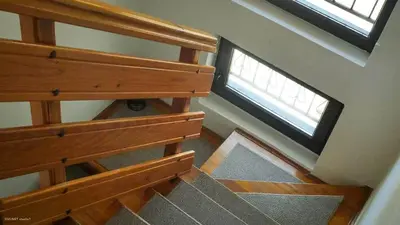 an overhead view of a wooden staircase with a window at Green Forest Visoko in Visoko