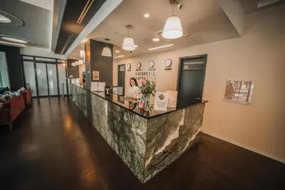a lobby with a marble counter in a building at Hotel Park Doboj in Doboj