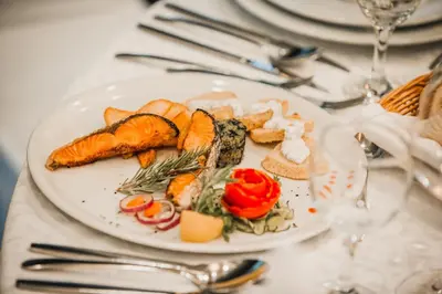 a white plate of food on a table at Hotel Park Doboj in Doboj