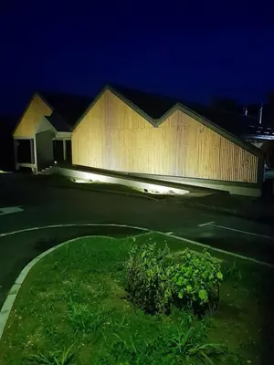 a building at night with a street in front at Apartman AS in Bihać