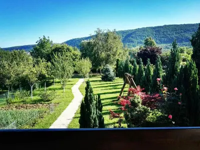 a view of a garden with trees and bushes at Green Oasis in Bihać