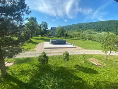 an overhead view of a park with a structure in a field at Vila Una 1 in Ripač
