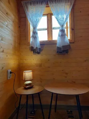 a room with two tables and a window at Etno selo EDEN in Žeravački Potok