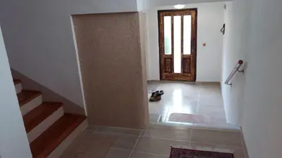 a room with a staircase and a door with a stair case at Vacation Home 