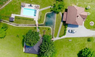 an overhead view of a yard with a pool at Vacation House Studenac in Bihać