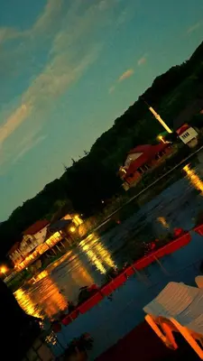 a view of a parking lot at night with lights at Villa Dino in Kulen Vakuf