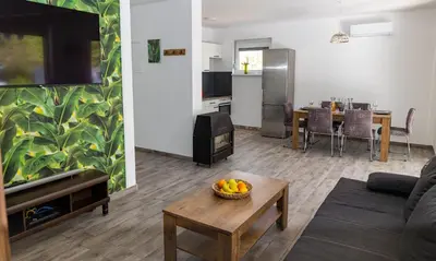 a living room with a couch and a table at simply-una in Bihać