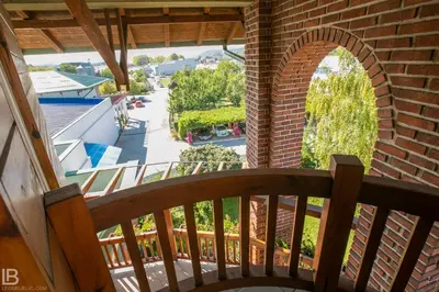 a view from the balcony of a house with a bench at Hotel Athos in Modriča