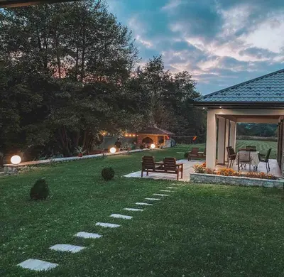 a park with a bench and a gazebo at Holiday home Green coast in Bosanska Krupa