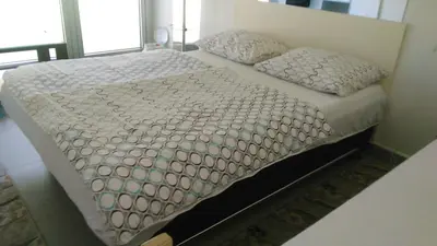 a bed with two pillows on it in a bedroom at Soba Centar in Banja Luka