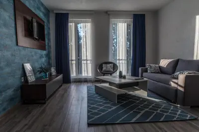 a living room with a couch and a table at Apartments and Rooms Villa Majestic in Bihać