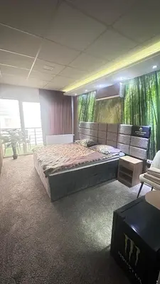 a bedroom with a large bed in a room at Gradiska Pristajko in Bosanska Gradiška