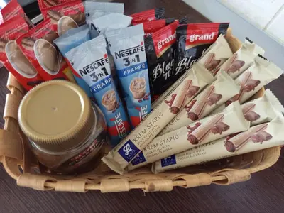 a basket filled with food and other snacks at Holiday Home Dzeni in Zenica