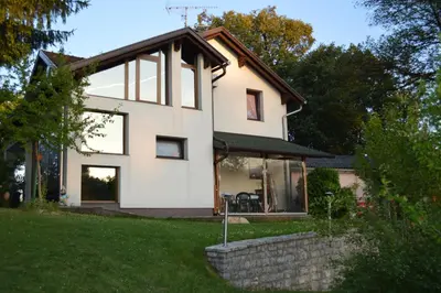 a white house with a roof at Villa My Island in Bihać