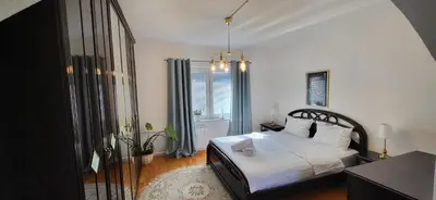a bedroom with a bed and a window at Mott Residence in Tuzla