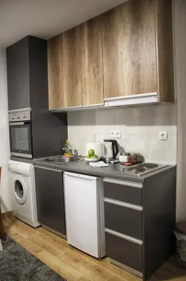 a kitchen with a sink and a dishwasher at Apartman Srdjan in Banja Luka