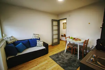 a living room with a couch and a table at Apartman Srdjan in Banja Luka