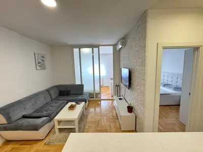 a living room with a couch and a bed at Apartment 4th. Floor in Banja Luka