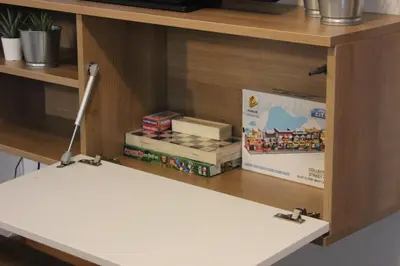 a shelf with a table with toys on it at 4 Seasons Vlašić Lux Apartments in Vlasic