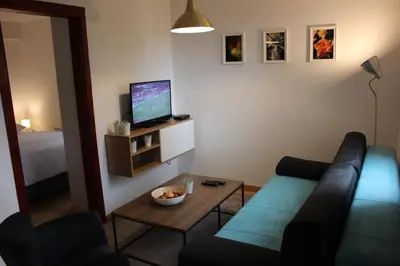 a living room with a couch and a tv at 4 Seasons Vlašić Lux Apartments in Vlasic
