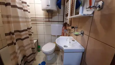 a small bathroom with a toilet and a sink at Ismar&Hanna in Vlasic