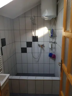 a bathroom with a shower with a tub at Vinac guest house in Jajce