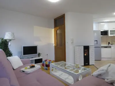 a living room with a couch and a coffee table at Winter Iris in Kupres