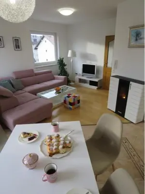 a living room with a table with food on it at Winter Iris in Kupres