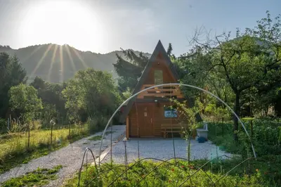 a small wooden cabin in the middle of a forest at Pyramid Energy House in Visoko