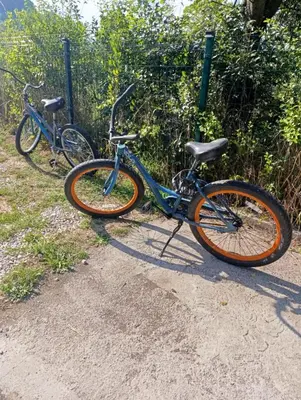 two bikes are parked next to a fence at Pyramid Energy House in Visoko