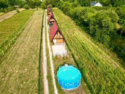 an overhead view of a farm with a boat in a field at Pyramid Energy House in Visoko