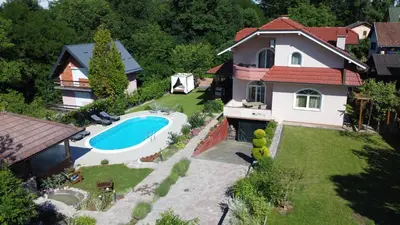 an aerial view of a house with a swimming pool at Villa Katarina with pool in Banja Luka