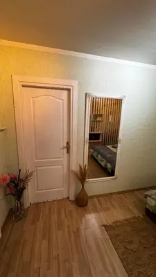 a room with a white door and a mirror at Fortuna in Banja Luka
