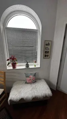 a window with a white pillow on a bench in a room at Fortuna in Banja Luka
