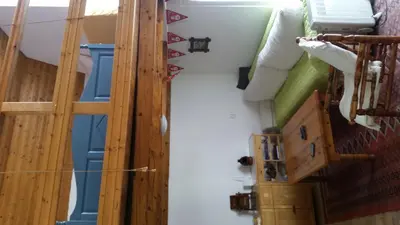 a view of a room with a staircase and a door at Vikendica Armin in Vlasic