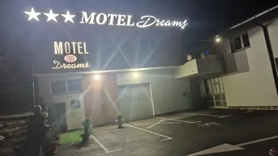 a motel dream sign on the side of a building at Motel Dreams in Novi Travnik