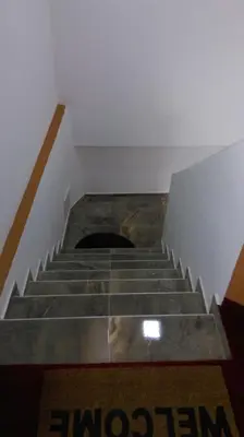 a set of stairs with a hole in the floor at Motel Dreams in Novi Travnik