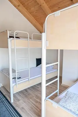 a bunk bed in a room with two bunk beds at Forest Dream Lake House in Jajce
