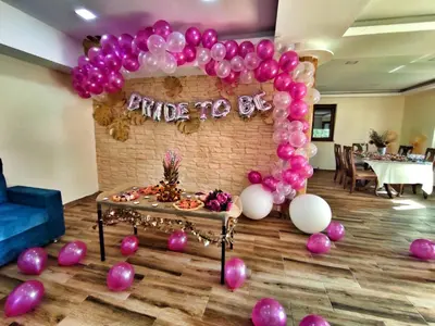 a balloon arch in a room with pink and white balloons at Vila Breza in Laktaši