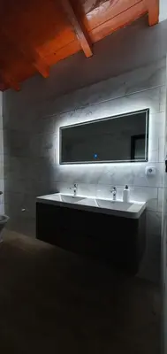 a bathroom with a sink and a mirror at Vila Breza in Laktaši