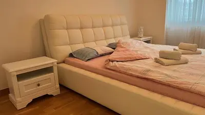 a bed with two pillows on it in a bedroom at apartman nejra in Tuzla