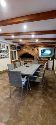 a large dining room with a large table and chairs at Green House Izvor Vrilo in Tomislavgrad