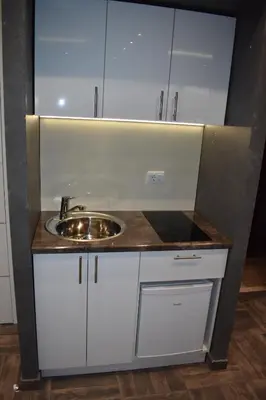 a bathroom with a sink and white cabinets at De Lux Apartment Maki in Banja Luka