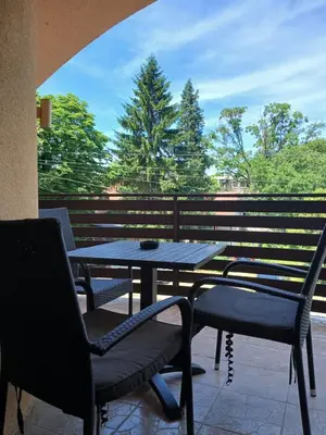 a table and chairs sitting on a patio at Provence rooms in Banja Luka