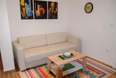 a living room with a couch and a coffee table at Apartman MAŠA in Banja Luka